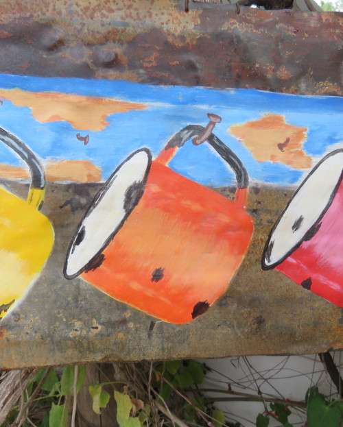 Interesting junk art by DEON ASSUR 2012. Painting of 3 enamel mugs on rusted plate.Size 58 x 25cm.