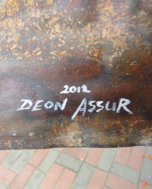 Interesting junk art by DEON ASSUR 2012. Painting of 3 enamel mugs on rusted plate.Size 58 x 25cm.