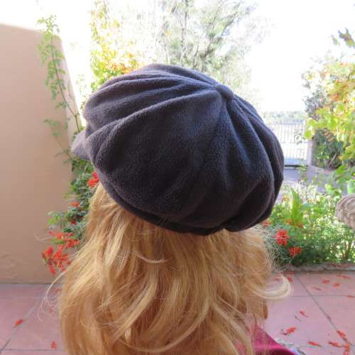 Warm grey brushed polyester octagonal ladies beret cap with elastic at back. Lined. As new.