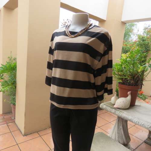 Real beaut! Black/rich cream horizontal stripes. Sheer black sleeve edging and back inlay.Size 38.