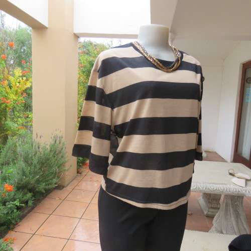 Real beaut! Black/rich cream horizontal stripes. Sheer black sleeve edging and back inlay.Size 38.