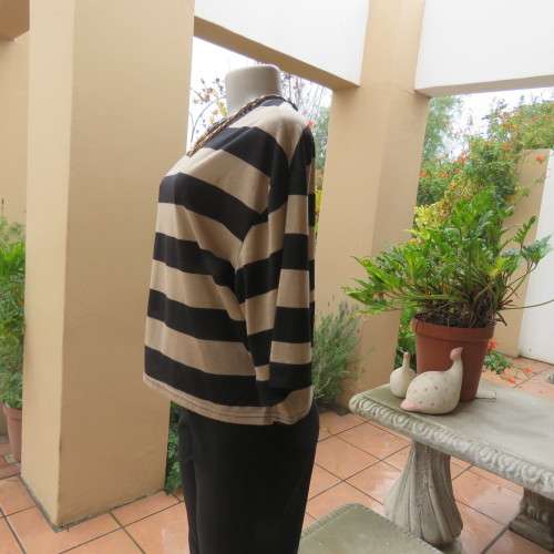 Real beaut! Black/rich cream horizontal stripes. Sheer black sleeve edging and back inlay.Size 38.