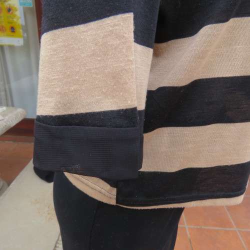Real beaut! Black/rich cream horizontal stripes. Sheer black sleeve edging and back inlay.Size 38.