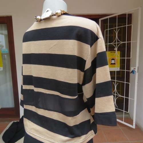 Real beaut! Black/rich cream horizontal stripes. Sheer black sleeve edging and back inlay.Size 38.