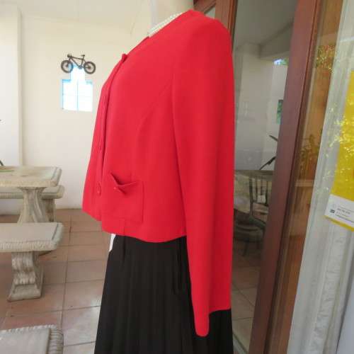 Cherry red long sleeve warm viscose/poly stretch cropped jacket.Button down front. Size 38. New cond