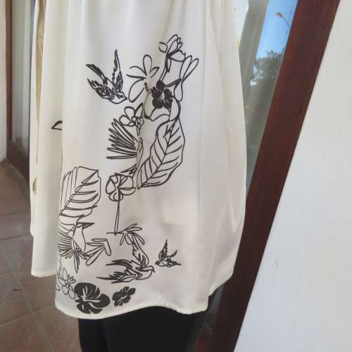 Silky rich cream satin empire top with black floral/bird print. Size 36 by RT.Elasticated under bust