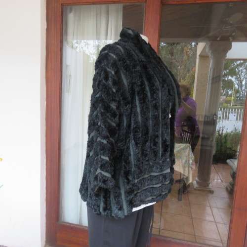 Vintage DE PARIS black faux fur jacket. Size 40. Elbow sleeves. Kangaroo pockets. Open front.