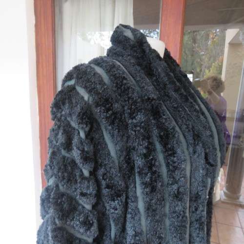 Vintage DE PARIS black faux fur jacket. Size 40. Elbow sleeves. Kangaroo pockets. Open front.
