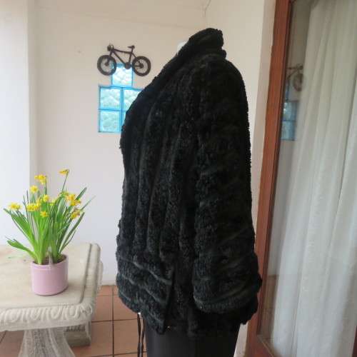 Vintage DE PARIS black faux fur jacket. Size 40. Elbow sleeves. Kangaroo pockets. Open front.