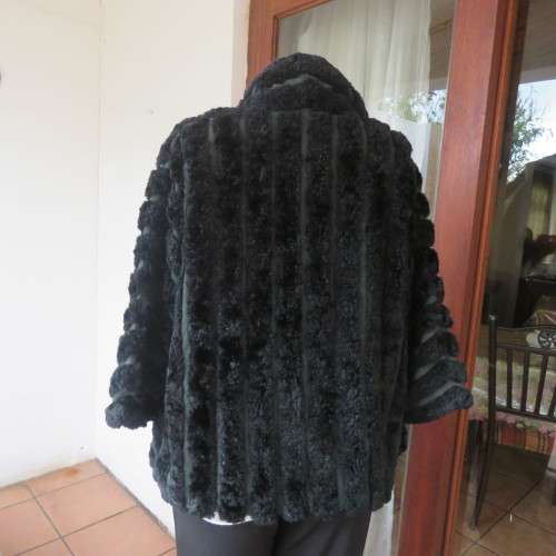 Vintage DE PARIS black faux fur jacket. Size 40. Elbow sleeves. Kangaroo pockets. Open front.