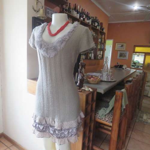 Unique ecru colour knitted dress in wool/poly and acrylic yarn.Scooped decorated neck.Size 36.As new