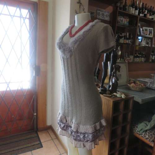 Unique ecru colour knitted dress in wool/poly and acrylic yarn.Scooped decorated neck.Size 36.As new
