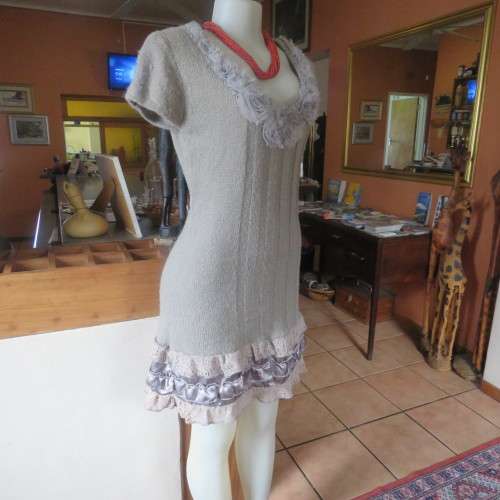 Unique ecru colour knitted dress in wool/poly and acrylic yarn.Scooped decorated neck.Size 36.As new