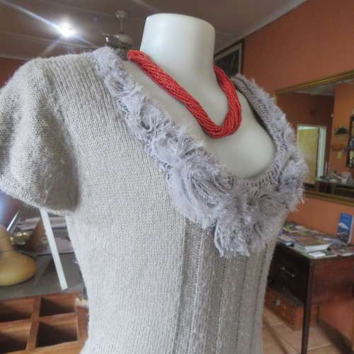 Unique ecru colour knitted dress in wool/poly and acrylic yarn.Scooped decorated neck.Size 36.As new