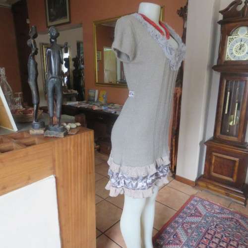 Unique ecru colour knitted dress in wool/poly and acrylic yarn.Scooped decorated neck.Size 36.As new