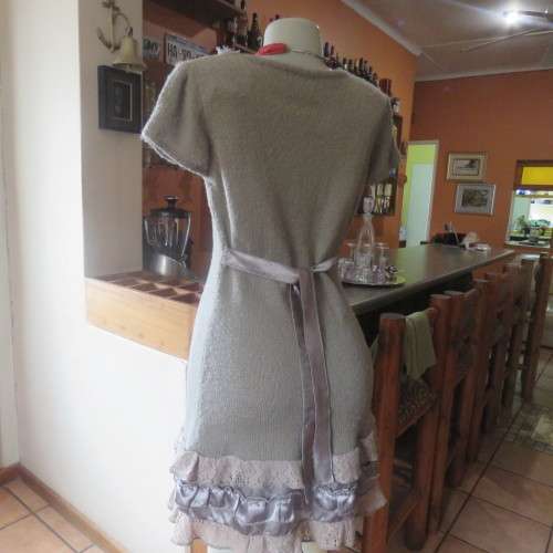 Unique ecru colour knitted dress in wool/poly and acrylic yarn.Scooped decorated neck.Size 36.As new