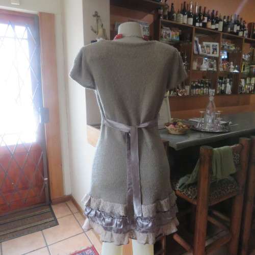 Unique ecru colour knitted dress in wool/poly and acrylic yarn.Scooped decorated neck.Size 36.As new