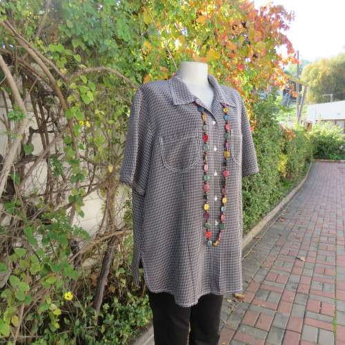 Classic short sleeve black/white check button down shirt. By DONNA CLAIRE size 42/18.Front pockets.