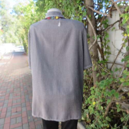 Classic short sleeve black/white check button down shirt. By DONNA CLAIRE size 42/18.Front pockets.