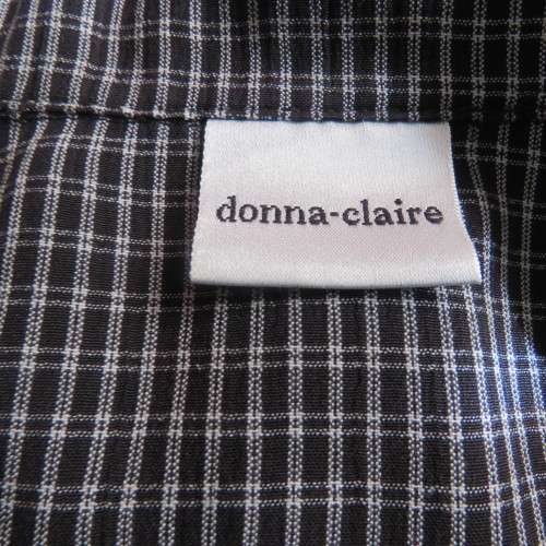 Classic short sleeve black/white check button down shirt. By DONNA CLAIRE size 42/18.Front pockets.
