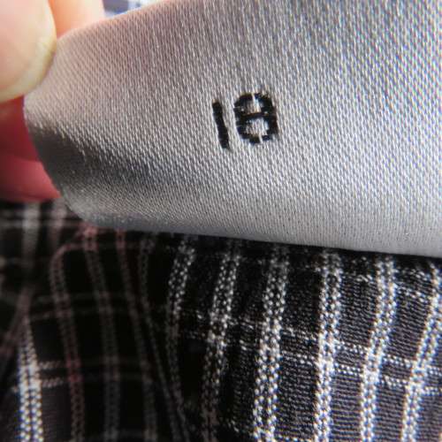 Classic short sleeve black/white check button down shirt. By DONNA CLAIRE size 42/18.Front pockets.