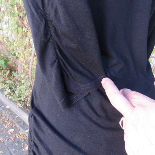Casual long black viscose stretch top with gathered bottom sides.Elbow sleeves.By WOOLWORTHS size 36