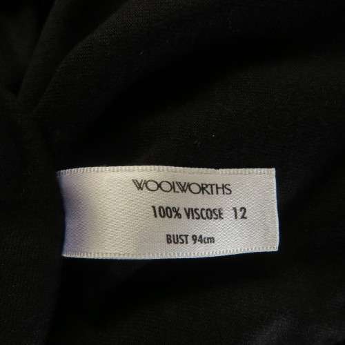 Casual long black viscose stretch top with gathered bottom sides.Elbow sleeves.By WOOLWORTHS size 36