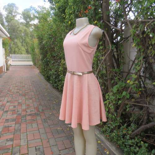 Sweet light peach stretch polyester skater style sleeveless dress by RT in size 36/12. Low back.