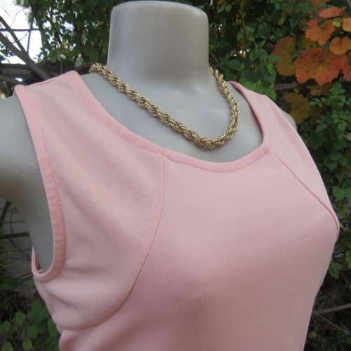 Sweet light peach stretch polyester skater style sleeveless dress by RT in size 36/12. Low back.