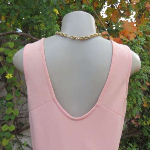 Sweet light peach stretch polyester skater style sleeveless dress by RT in size 36/12. Low back.