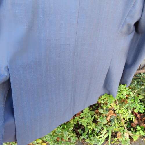 As new steel blue/subtle check 2 pc check suit by PETROCELLI in trevira/wool. Jacket 44R.Pants 38.