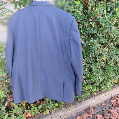 As new steel blue/subtle check 2 pc check suit by PETROCELLI in trevira/wool. Jacket 44R.Pants 38.