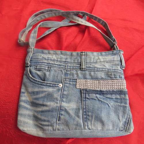 Fashion light blue denim shoulder bag size 28cm x 23cm. Lined with zip-up pocket. Never used.