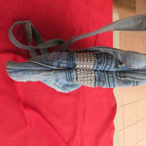 Fashion light blue denim shoulder bag size 28cm x 23cm. Lined with zip-up pocket. Never used.