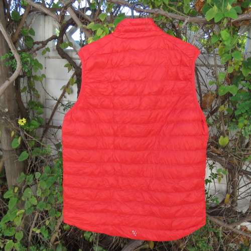 MAC in a SAC with alpine 80gr down gilet in scarlet red. Size Large. Pack in small bag.Brand new.