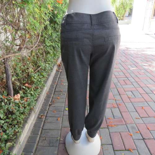 Perfect fit fine black/grey check size 34 low rise pants by LEGIT. Poly/rayon stretch. Leg cuffs.