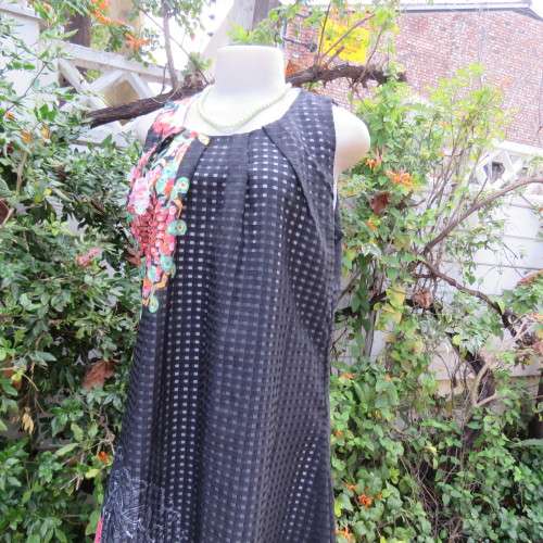 Cool black opaque check A-line dress with white lining. Bold floral design. Size 38 by JUDY,S PRIDE.