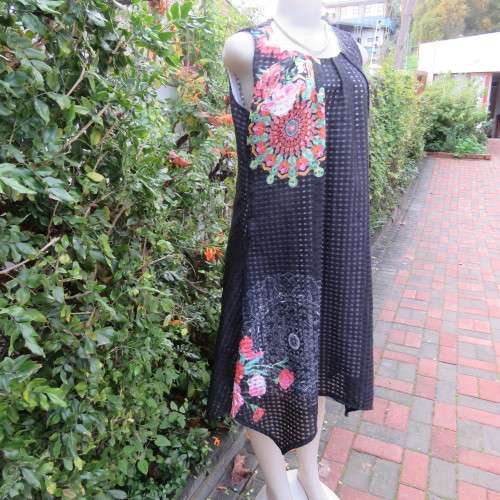 Cool black opaque check A-line dress with white lining. Bold floral design. Size 38 by JUDY,S PRIDE.