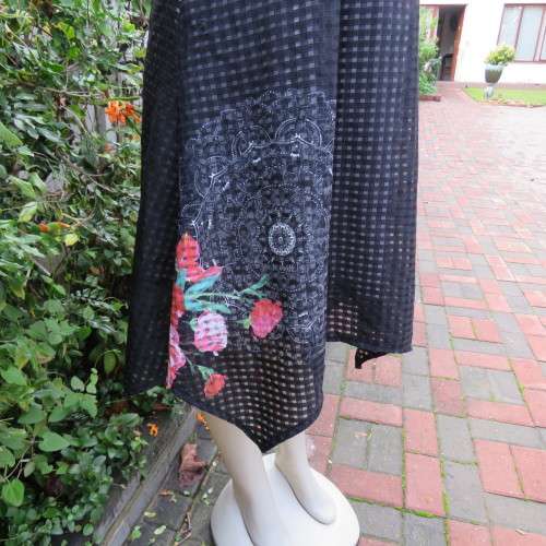 Cool black opaque check A-line dress with white lining. Bold floral design. Size 38 by JUDY,S PRIDE.