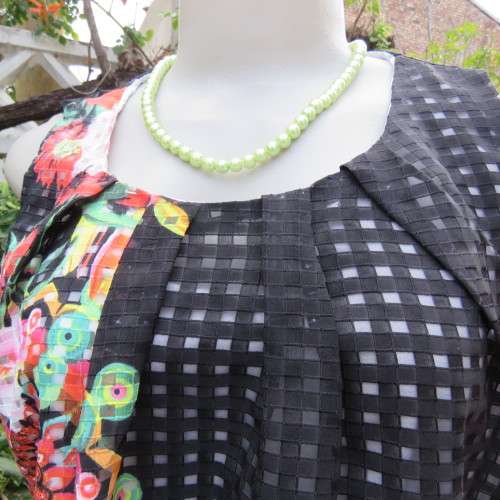 Cool black opaque check A-line dress with white lining. Bold floral design. Size 38 by JUDY,S PRIDE.
