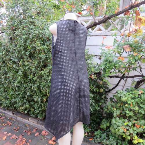 Cool black opaque check A-line dress with white lining. Bold floral design. Size 38 by JUDY,S PRIDE.
