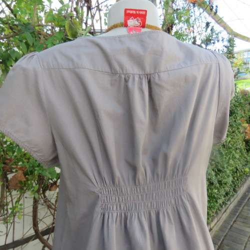 Chic loose ecru colour long top. Capped sleeves.Front lace decoration.Size 36