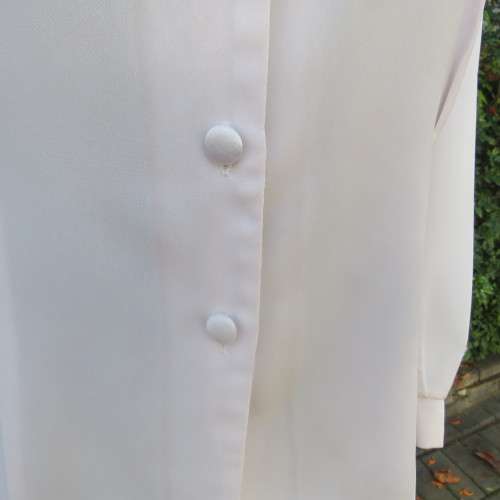 Smart long sleeve off-white top. Button down with satin covered buttons/shirt collar.Size 40. M.H.