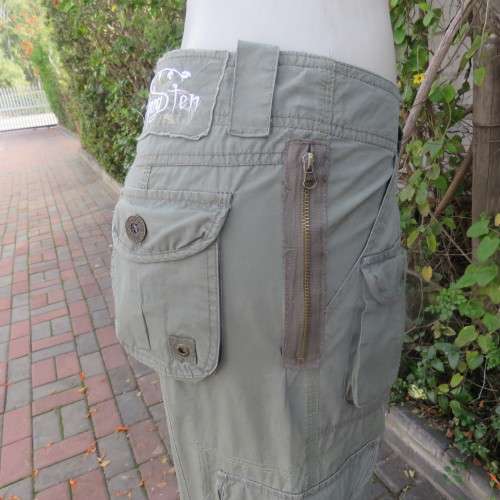 Ladies dark olive green cargo pants. HANG TEN size 36/12. Bellow pockets.Stud/zip decoration.As new
