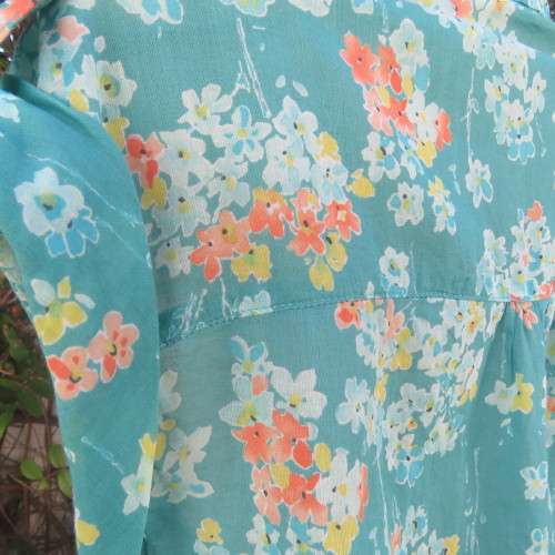 Cool summer 100% cotton turquoise top yellow/orange daisies. By PROMOD France. Size 38/14.As new