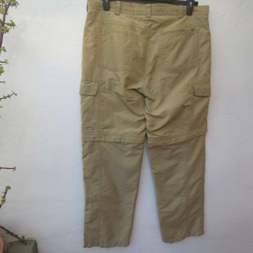 Men`s rip off hiking pants in tan by SCHOFFEL from Germany. Size 38. Pockets .Cotton/nylon.As new