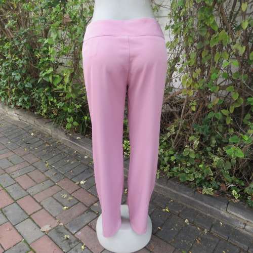 Dusty pink straight legged dress pants in rich polyester blends. Some stretch. Size 34/10. As new.