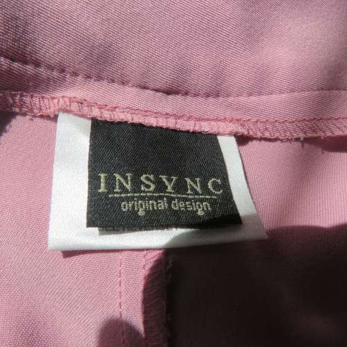 Dusty pink straight legged dress pants in rich polyester blends. Some stretch. Size 34/10. As new.