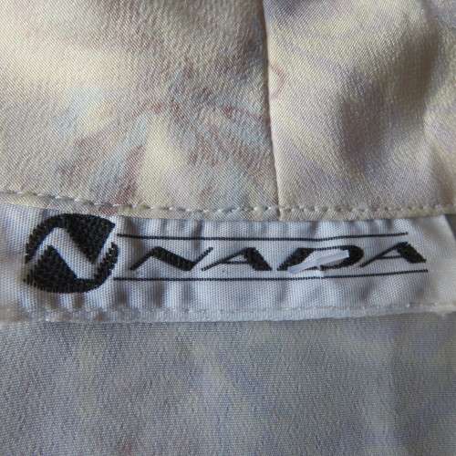 Twin set top in soft lilac and white floral patterns.. Size 36/12 by NADA. Very good condition.