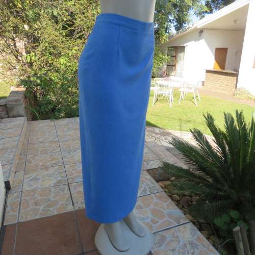 High waisted boutique made cobalt blue pencil skirt size 40/16. Elastic in side waist.Back zip/slit.